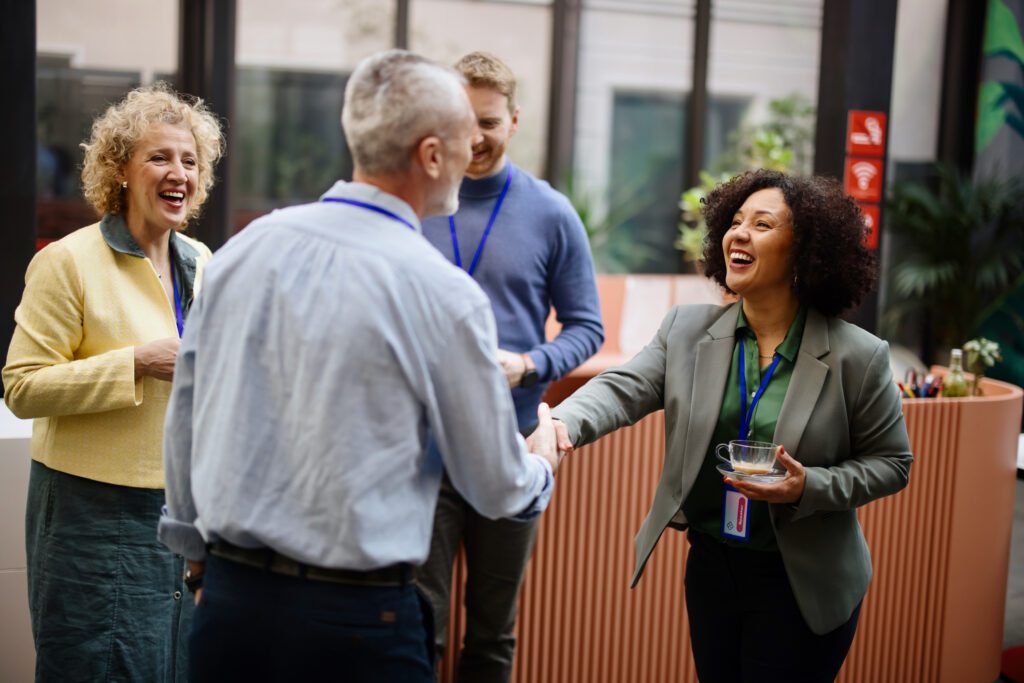 A handshake happening at a conference 